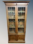 A late Victorian oak Arts and Crafts bookcase,