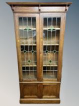 A late Victorian oak Arts and Crafts bookcase,