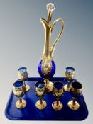 A blue glass gilded ewer, height 48 cm,