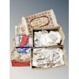 Two boxes containing a Turkish silk piled rug and various linen,