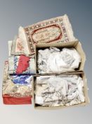 Two boxes containing a Turkish silk piled rug and various linen,