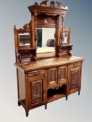 A late Victorian walnut mirror backed sideboard,