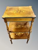 A 19th century French walnut and satinwood inlaid three tier work table with velvet lined interior,
