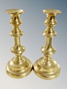 A pair of brass candlesticks, height 22.