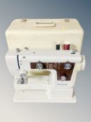 A New Home electric sewing machine in box with lead,