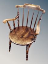 A stained beech spindle back armchair