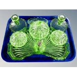 An Art Deco green glass eight piece dressing table set