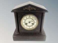A late Victorian black slate mantel clock,