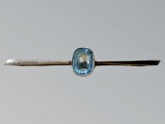 A 9ct yellow gold bar brooch set with simulated aquamarine