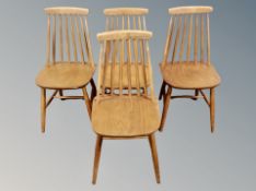 A set of four 20th century spindle back dining chairs
