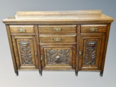 A late Victorian oak Arts and Crafts sideboard,