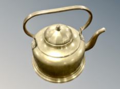 A large brass kettle,