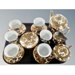 A fifteen piece gilt porcelain tea set