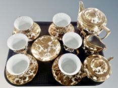 A fifteen piece gilt porcelain tea set