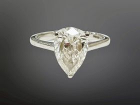 A platinum diamond solitaire ring, the pear-shaped stone 2.