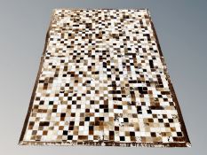 A Barker & Stonehouse cow skin rug,