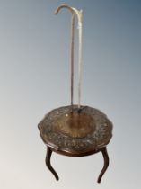 A carved oak occasional table with shaped top together with an antler handled walking stick and one