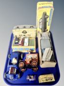 A group of vintage die cast vehicles, tin plate wind up circus wagon, caravan,