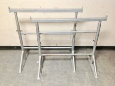 Two painted metal adjustable builder's stands