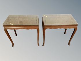 A pair of reproduction mahogany lamp tables on cabriole legs with plate glass tops,