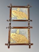 A pair of 19th century carved pine cruciform frames with panels depicting Koi fish,