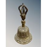 A 19th century Tibetan brass Vajra bell, height 16cm.