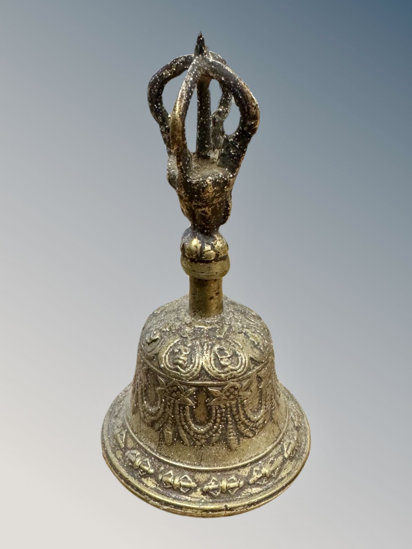 A 19th century Tibetan brass Vajra bell, height 16cm.