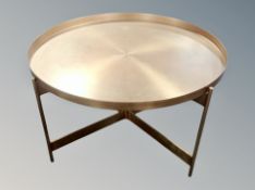A circular copper coffee table,