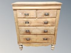 An early 20th century pine five drawer chest