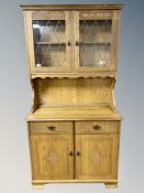 A Newplan Furniture oak dresser, width 94 cm, and matching bureau.