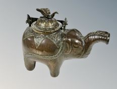 An Indian brass teapot in the form of an elephant,