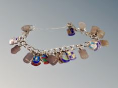 A silver padlock bracelet with enamelled town crests