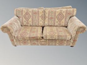 A contemporary three seater settee,