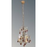 An early 20th century chandelier with amber glass drops