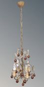 An early 20th century chandelier with amber glass drops