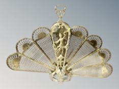 A brass 'Peacock' firescreen