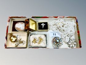 A cameo brooch together with costume jewellery, white metal crucifix ring,