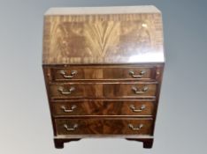A George III style mahogany bureau,