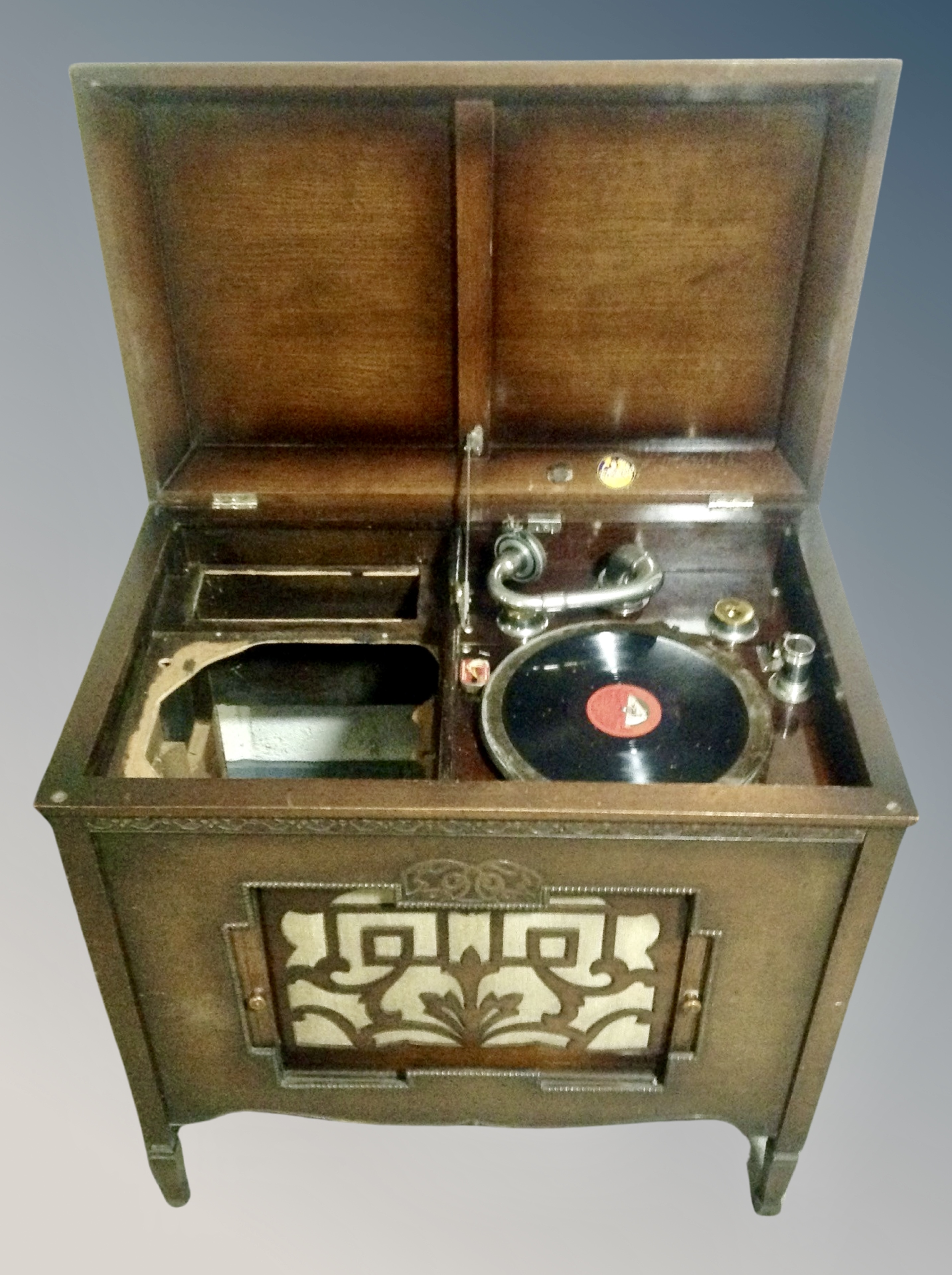 A Geisha gramophone in oak cabinet and a box containing assorted 78's
