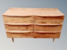 A contemporary hardwood six drawer chest,