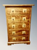 A Barker & Stonehouse Flagstone chest of five drawers,