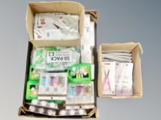 A box of revolution hand gel, car first aid travel kits, cosmetic items,