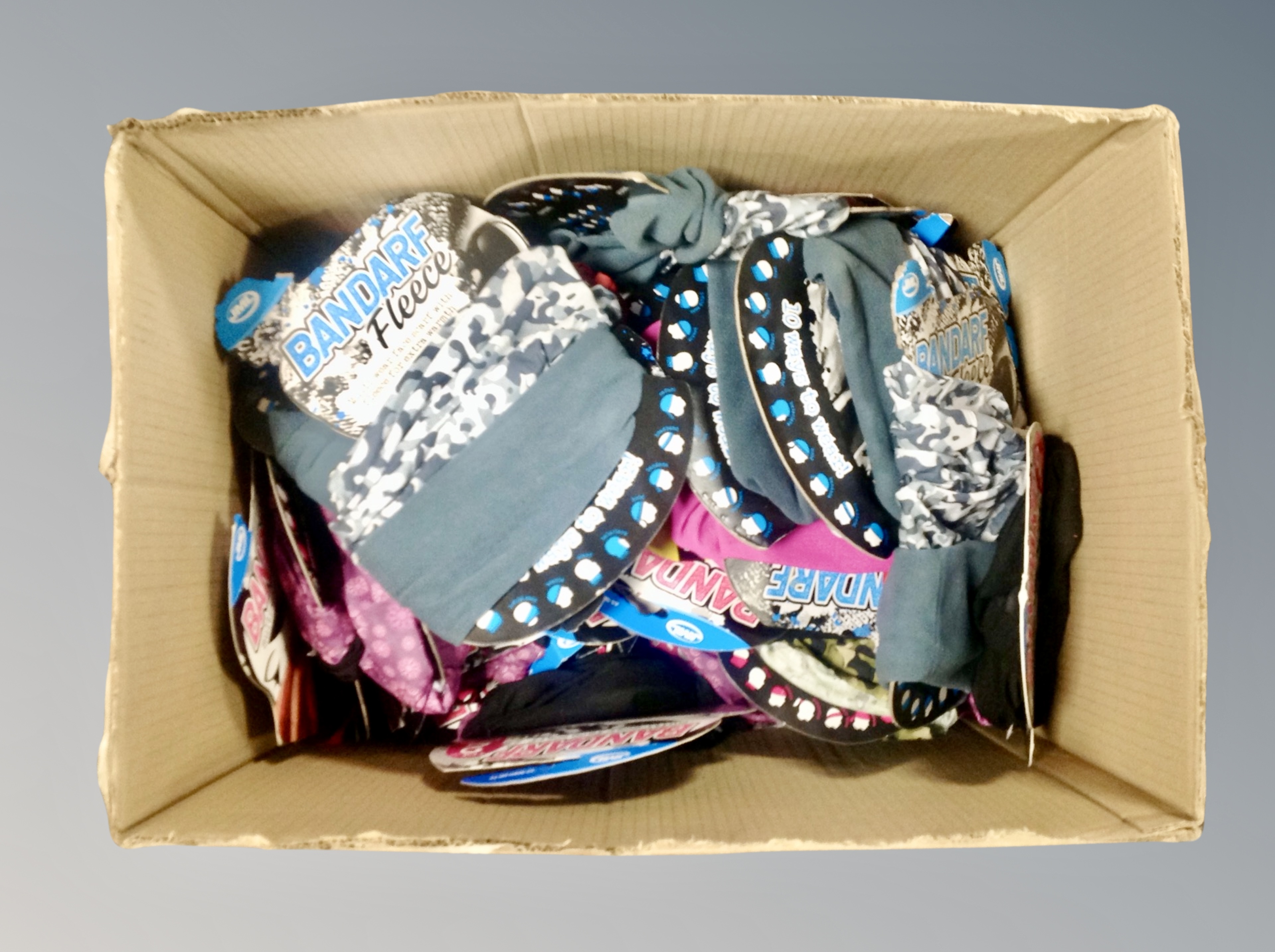 A box of Bandarf fleece face scarves