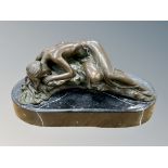 A bronze figure of a sleeping semi-nude female on black marble plinth, width 22cm.