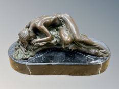 A bronze figure of a sleeping semi-nude female on black marble plinth, width 22cm.
