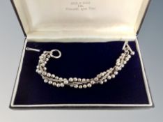 A silver fancy link helix twist bracelet in Reid & Sons box,