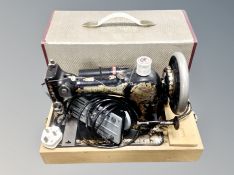 A Jones electric sewing machine with lead and pedal