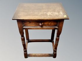 An oak single drawer side table,