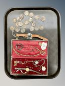 An antique pocket watch chain together with Victorian copper coins, buckle,