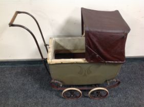 A 1920's Leeway doll's pram